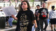 Photo Gallery: Quiet t-shirt protest at Americana at Brand